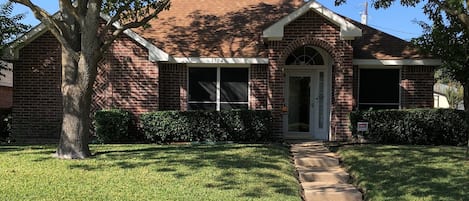 Quaint house in quiet tree-lined family-friendly neighborhood.