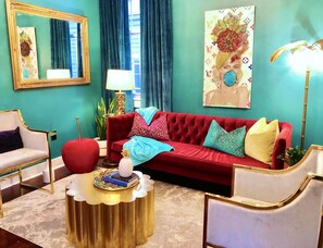 Vibrant and fun living room of the 2-bedroom Mardi Gras suite. 