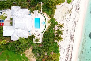 Aerial view of villa and beach.