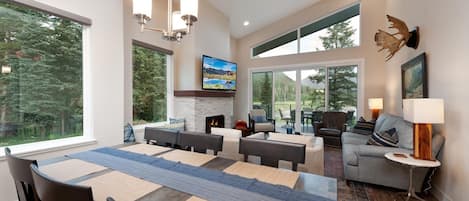 Main Living Space and Dining Spaces (TV, Gas Fireplace, Deck, Views and plenty of windows