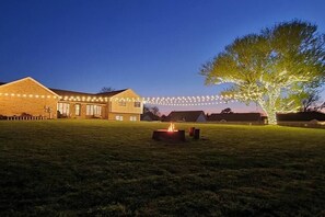 Backyard with Fire Pit and Market Lights