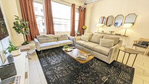 Art Deco lounge with plush seating and dramatic Hollywood touches.