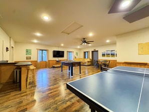 Our game room features foosball, ping pong table, ring toss, card table, kids's air hockey(floor model), Smart TV, kitchenette, bathroom, sauna, and more.
