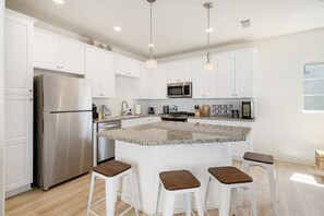 The large kitchen island is where everyone wants to be!  Fully stocked!