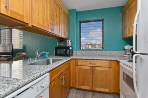 Full kitchen with cooking utensils