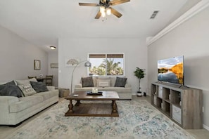 Open concept living area - ROKU TV - open to kitchen and dining area. Cozy comfortable couch and layout