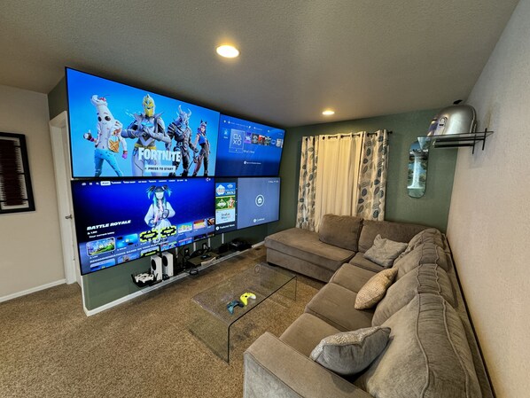 Gaming wall with 4-70” Samsung tvs, 2 Xbox series s, Nintendo switch, ps4