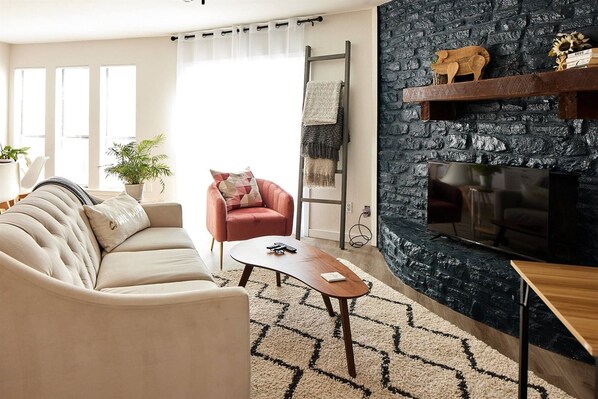Unwind with a glass of wine after a long day. Enjoy the comfortable living room has seating for 4 guests to enjoy a 42" Smart TV with Netflix subscription. Feel free to curl up with a throw blanket!