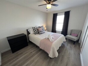 This bed in the secondary bedroom features a comfy mattress and quality sheets.