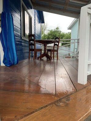 Large rap around porch with hammock and out door furniture for relaxing