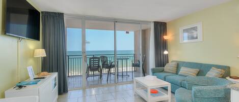 The ocean front living room is well-appointed with comfortable furnishings.