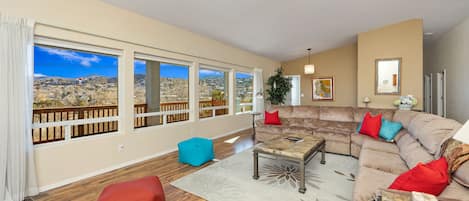 Living room with views of patio and P Mountain