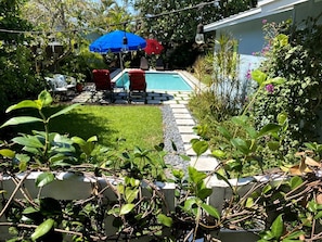 Lush landscaping with an extra large private, heated pool