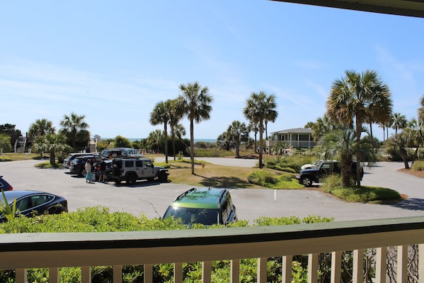 You get peeks of the ocean from Sea Cabin 115 A's balcony! You can also see the pool house, pier gate and parking lot. There are four chairs to enjoy the ocean breeze or enjoy your morning coffee.