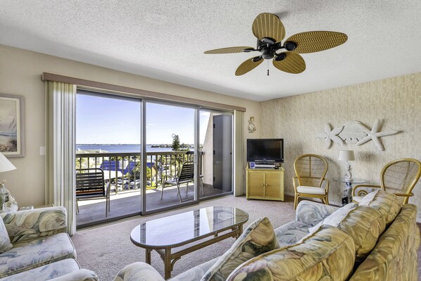Unit # 507, Triple Wide Patio door gives a Panoramic View of Boca Ciega Bay from the Living Room