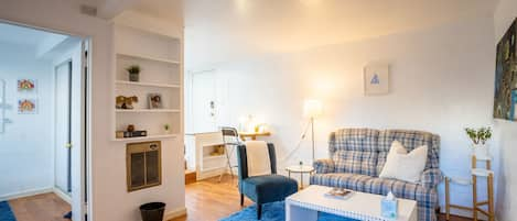 A cozy living room with a stylish corner workstation.