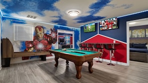 Fantastic Marvel Themed Game Room with Air Hockey, Foosball, Arcade Games and Flat Screen TV and more!