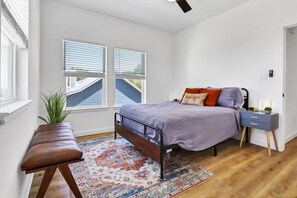 The primary bedroom has a queen bed