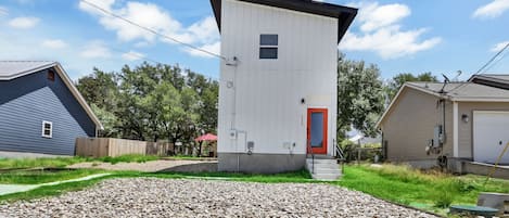 Gravel parking in front of the home