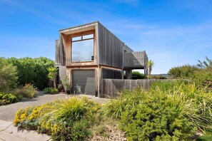 Distinctive Cypress clad home.