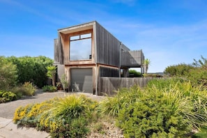 Distinctive Cypress clad home.