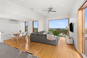 The upper level incorporates open plan living, kitchen and dining.