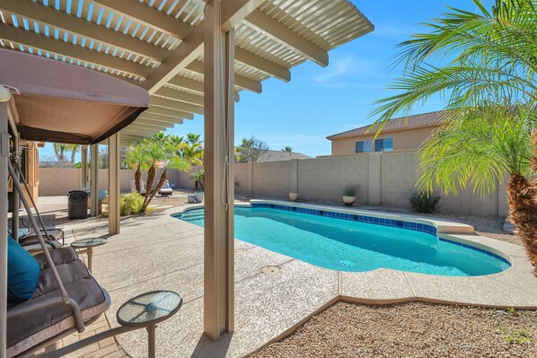 Backyard Pool with Large Pergola covering