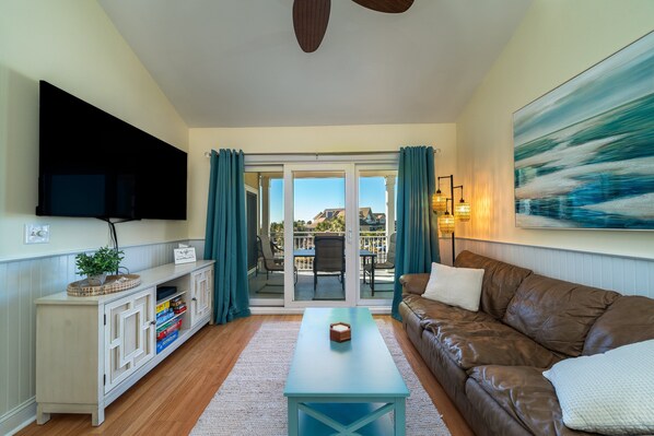 The great room is the central hub of this villa and leads out to the spacious balcony!