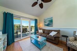 Sliding doors out to the large covered porch/balcony