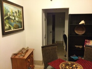 Lovely view of the dining room complemented by beautiful wall painting.