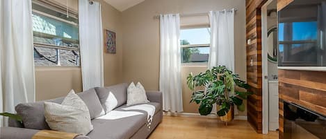 Ample windows provide soft, welcoming light in the common areas.