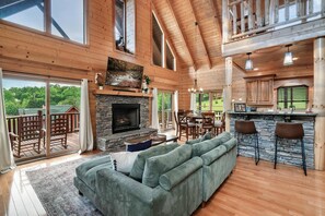 Bright, Open Living Space with Cathedral Ceilings, Fireplace & Natural Light