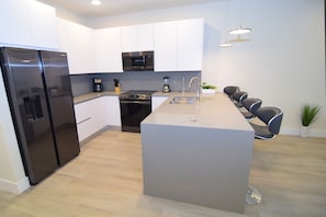 Beautiful modern kitchen with all appliances for dining at home