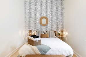 Queen bed. Sound machine. Blackout blinds. Serena and Lily wallpaper. Closet.
