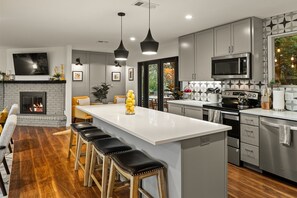 Modern fully equipped kitchen  with granite center island