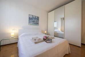 Double bedroom with wardrobe and TV