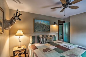 Main floor bedroom with a king bed, featuring rustic decor and local charm.