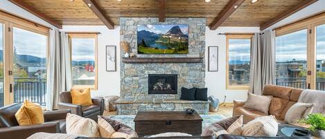 Framed by accordion doors & a wood-inlaid ceiling, the living room is a beautiful space for the whole group to gather.