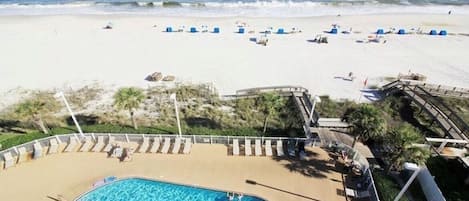 View of beach and pool from balcony