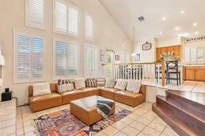 Living room opens to kitchen, with 30 foot cathedral ceilings.