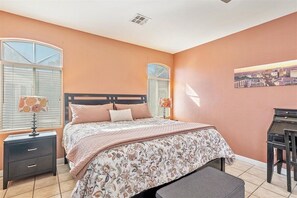 Master bedroom with a desk.