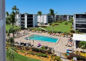Your pool with chaises, umbrellas, and bathrooms. No streets to cross!
