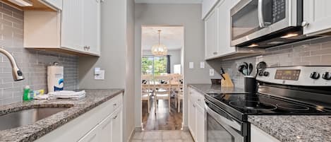 Beadboard cabinets with granite countertops 