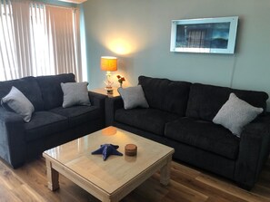 LR w/ Queen Sleeper Sofa; 2 Sliding Glass Doors open to Small Deck w/ Canopy 
