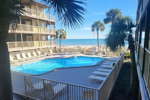 Your perfect getaway starts here. Imagine lounging by this pool with ocean views.