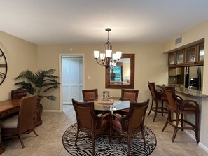 Dining area seats 4 plus 2 more at the bar stools. 