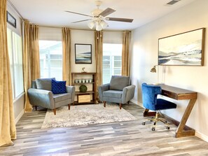 Front entry room with desk and seating