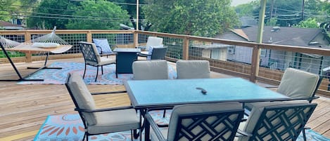 Rooftop Deck with covered table, propane fire pit, hammock
