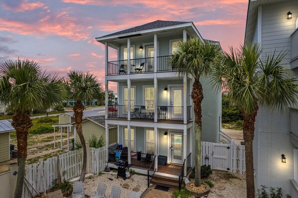 Three balconies overlooking the pool and patio area.