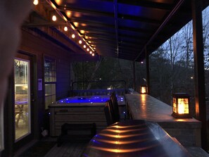 Pigeon Forge Cabin - Majestic Poolside Lookout - Covered back deck with hot tub at night